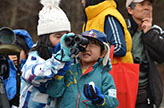 Children using binoculars for the first time during a wild bird observation activity
